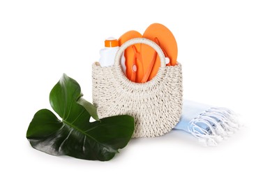 Photo of Stylish bag with beach accessories isolated on white