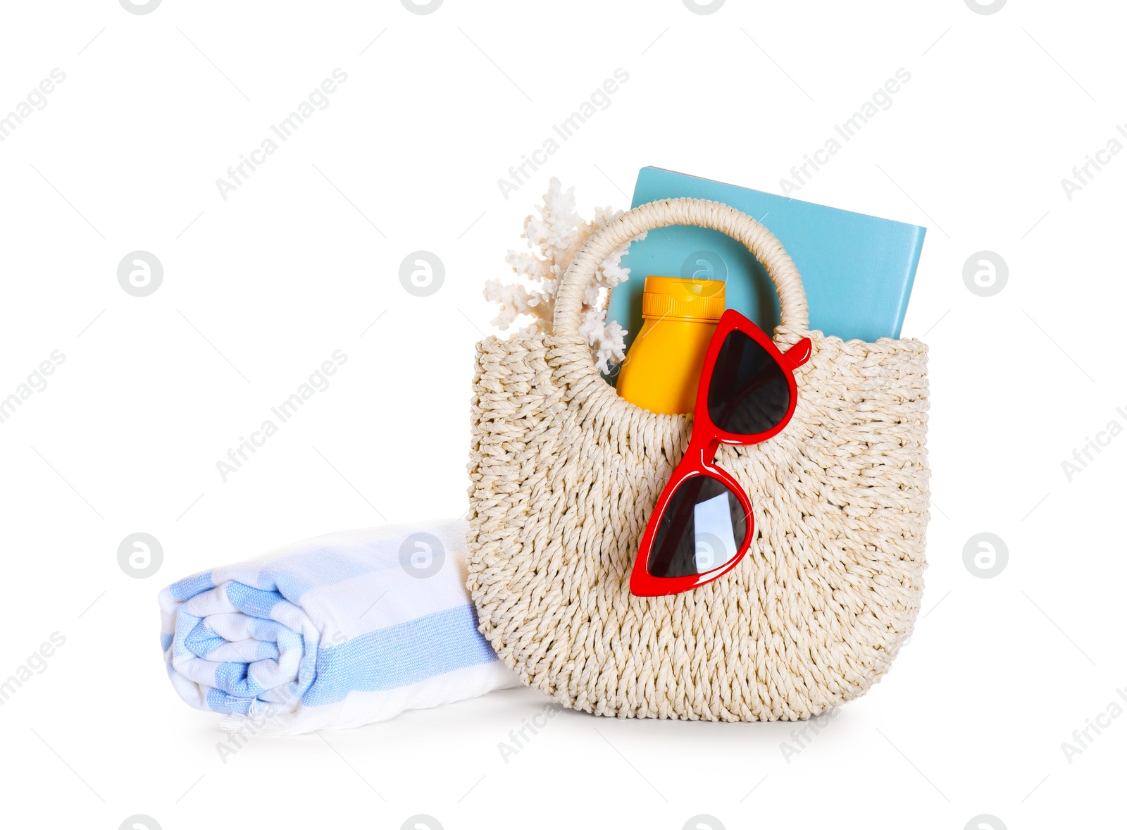 Stylish bag with beach accessories isolated on white Photo of Stylish bag with beach accessories isolated on white