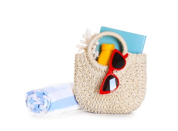 Photo of Stylish bag with beach accessories isolated on white
