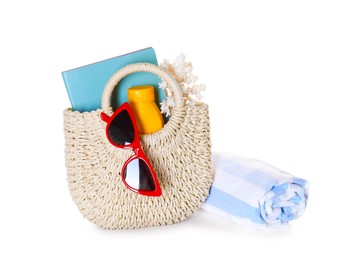 Photo of Stylish bag with beach accessories isolated on white