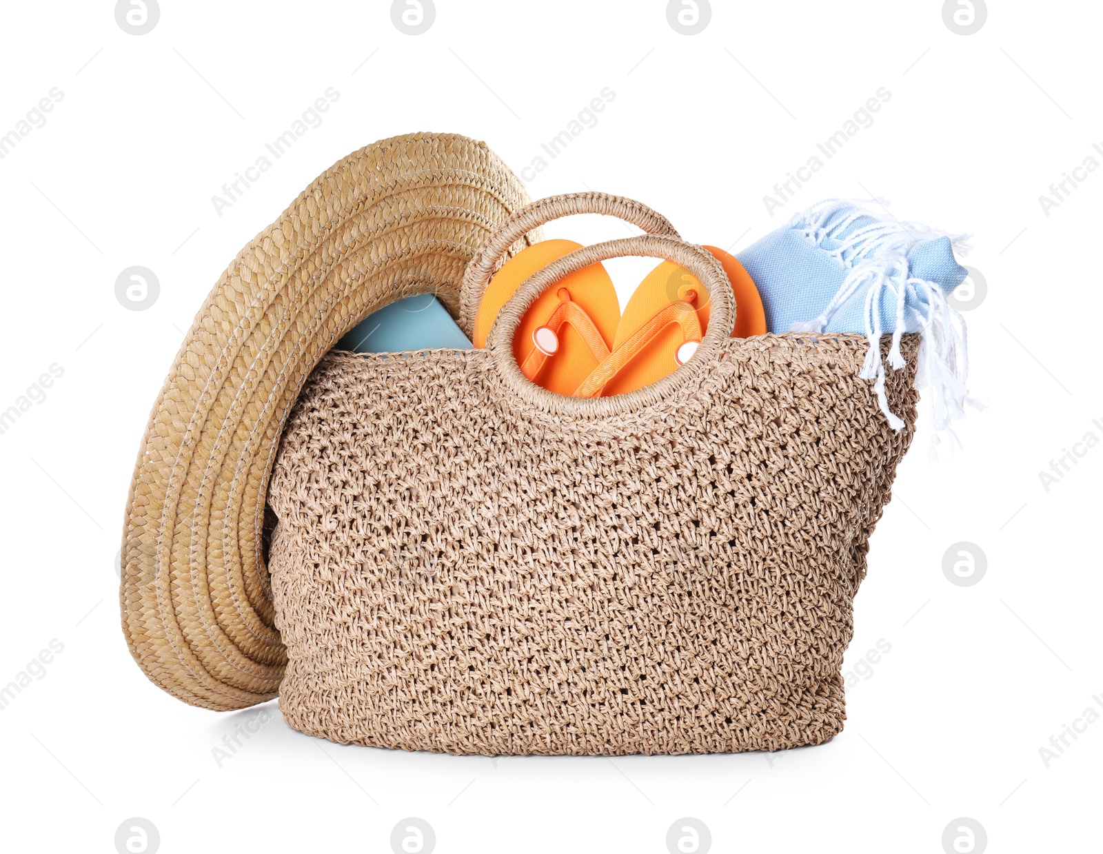 Stylish bag with beach accessories isolated on white Photo of Stylish bag with beach accessories isolated on white