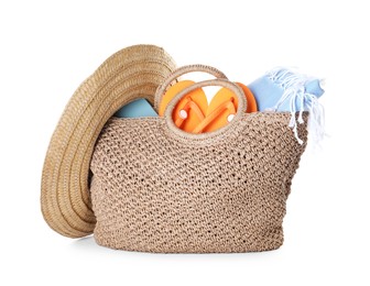 Photo of Stylish bag with beach accessories isolated on white