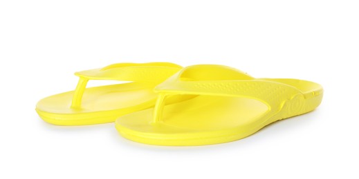 Photo of Yellow flip-flops isolated on white. Beach accessory
