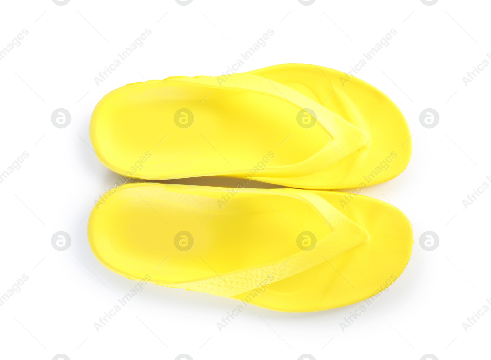 Yellow flip-flops isolated on white, top view. Beach accessory Photo of Yellow flip-flops isolated on white, top view. Beach accessory