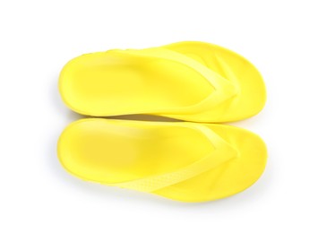 Photo of Yellow flip-flops isolated on white, top view. Beach accessory