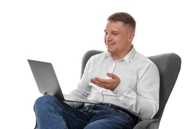 Photo of Smiling psychologist during online session by laptop sitting on armchair against white background