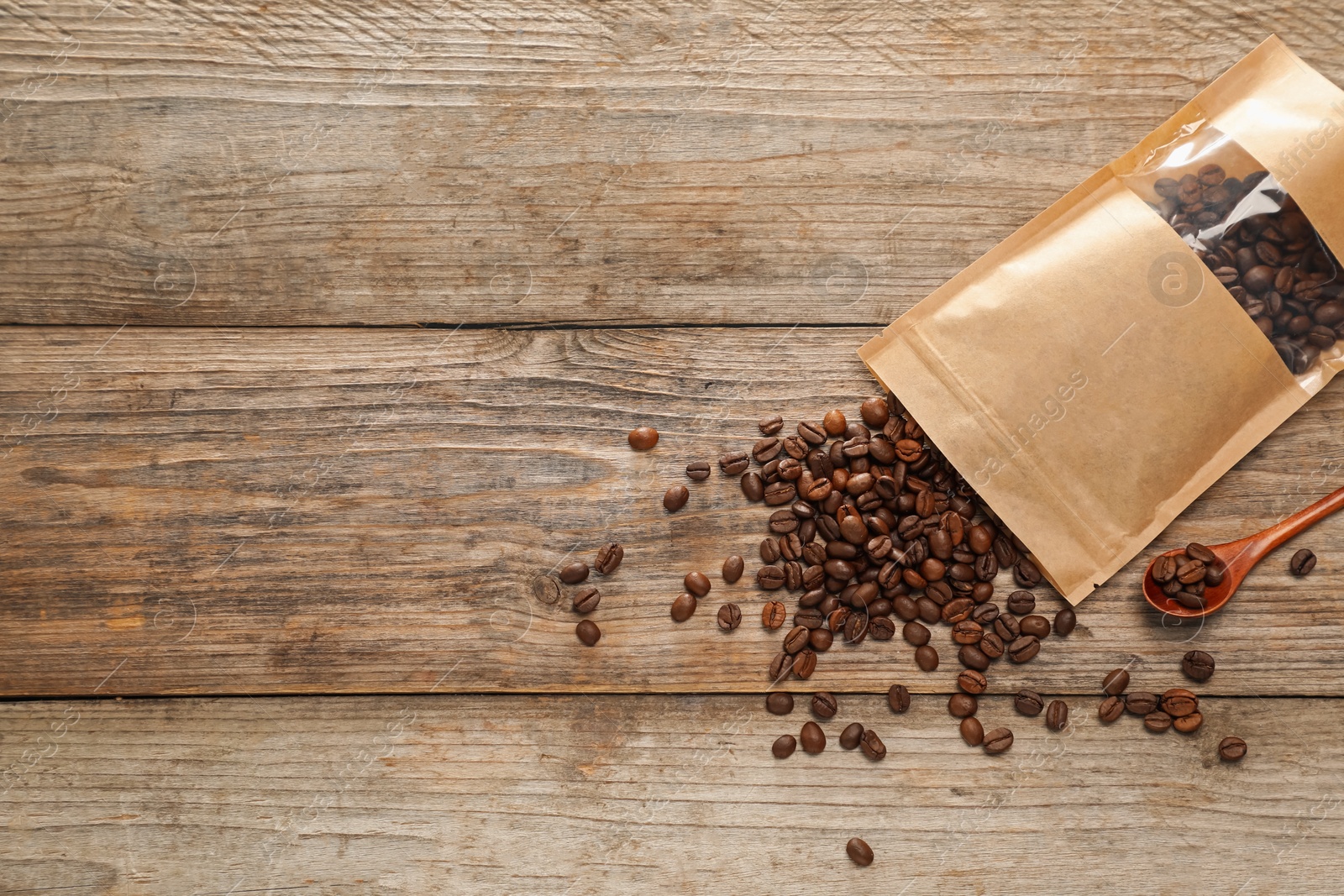 Zipper stand-up pouch with coffee beans on wooden table, flat lay. Mockup for design Photo of Zipper stand-up pouch with coffee beans on wooden table, flat lay. Mockup for design