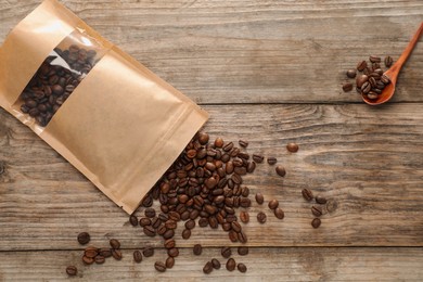 Photo of Zipper stand-up pouch with coffee beans on wooden table, flat lay. Mockup for design