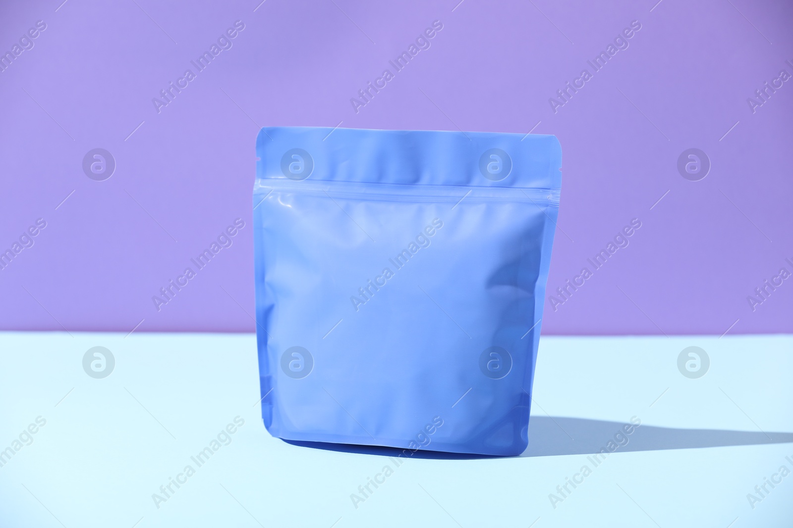 Zipper stand-up pouch on color background, mockup for design Photo of Zipper stand-up pouch on color background, mockup for design