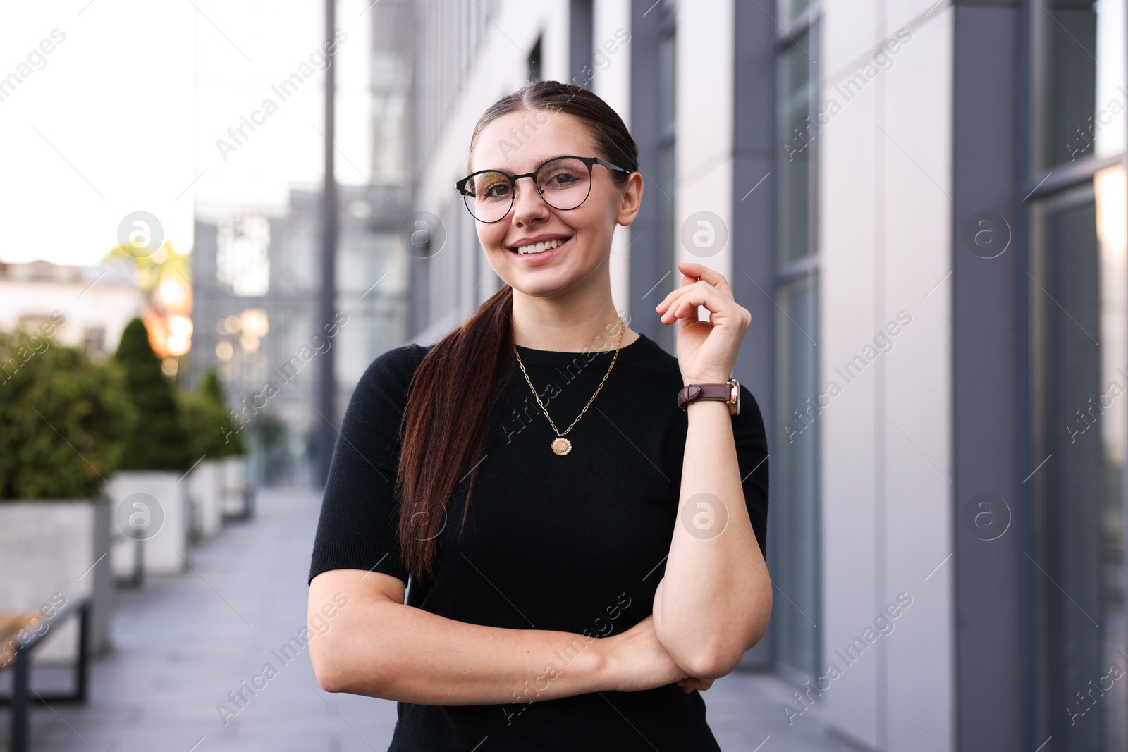Portrait of successful businesswoman near office building Photo of Portrait of successful businesswoman near office building