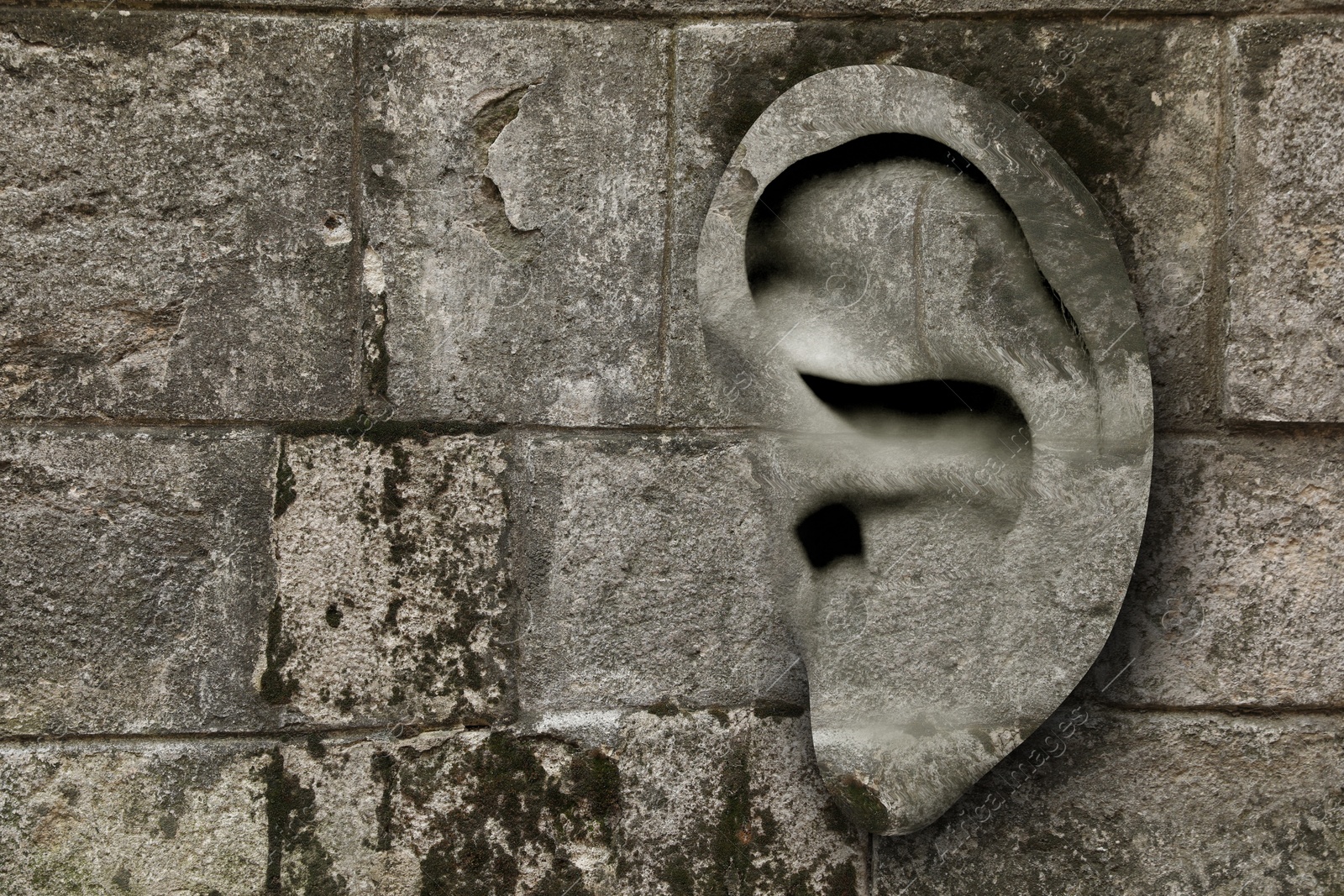 Image of Human ear in stone wall, space for text. Eavesdropping, concept that even walls have ears