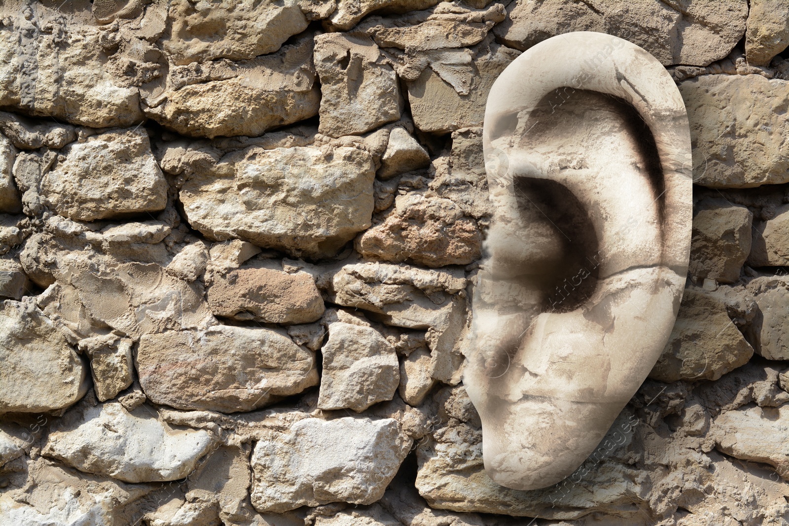 Image of Human ear in old stone wall, space for text. Eavesdropping, concept that even walls have ears