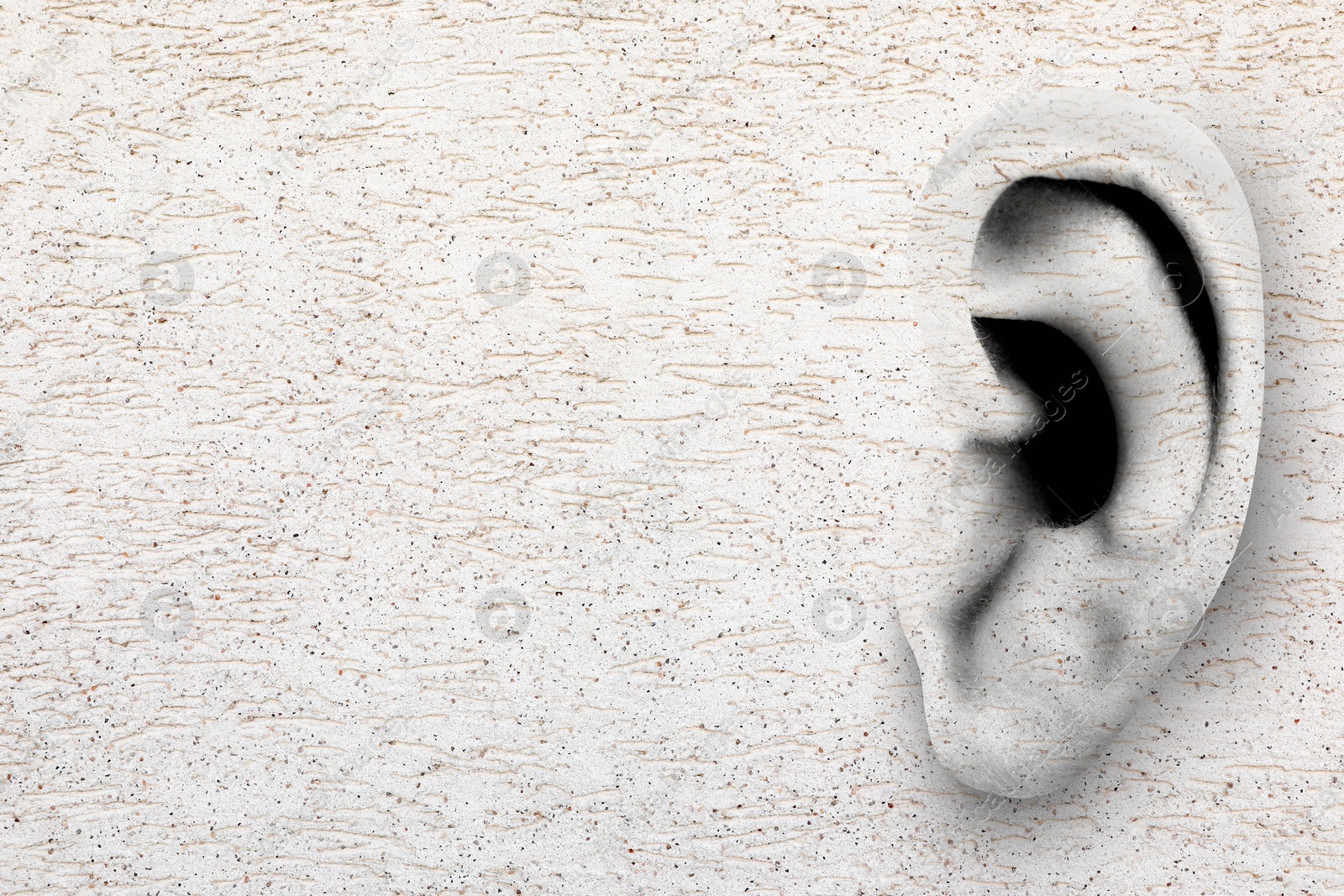 Image of Human ear in white plaster wall, space for text. Eavesdropping, concept that even walls have ears