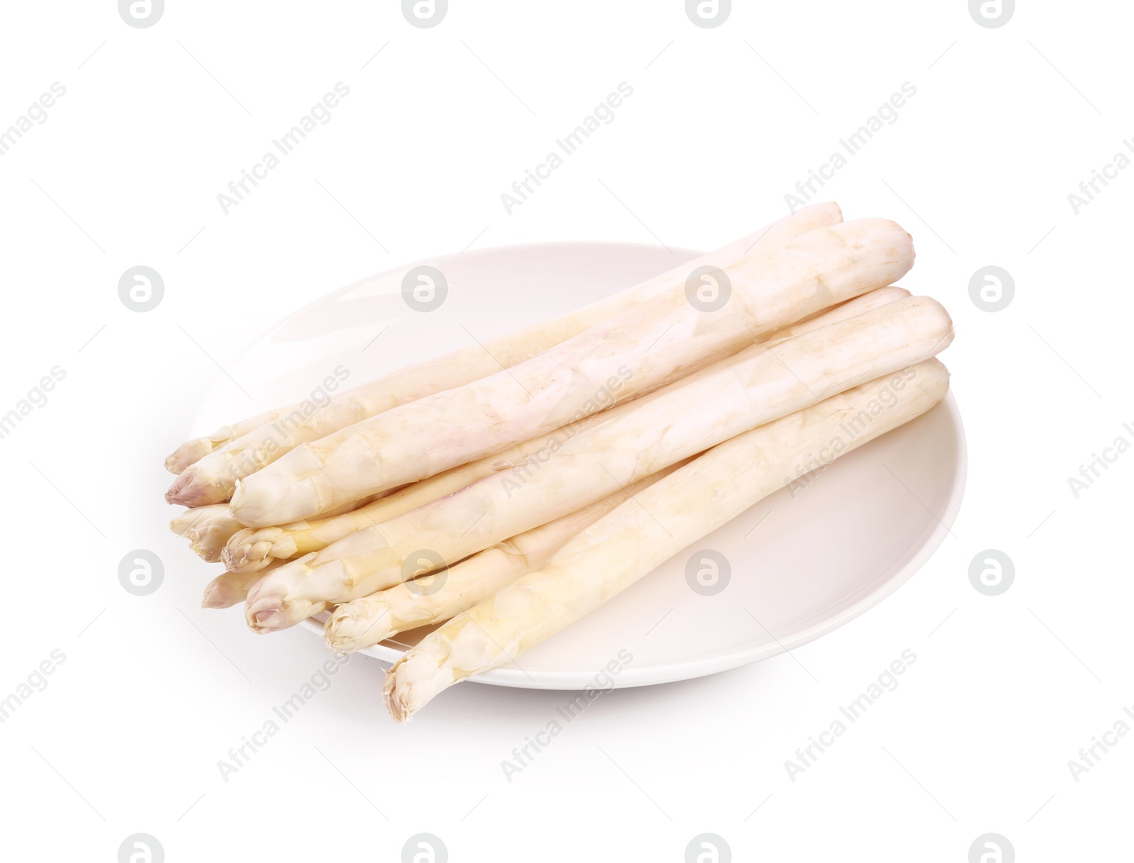 Many raw asparagus spears isolated on white Photo of Many raw asparagus spears isolated on white