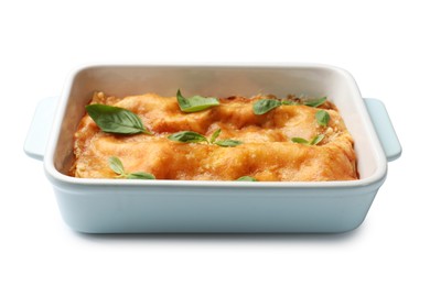 Photo of Tasty vegetarian lasagna in baking dish isolated on white