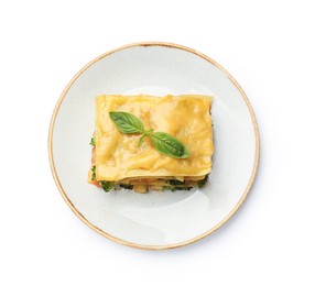 Photo of Piece of tasty vegetarian lasagna isolated on white, top view