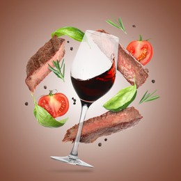 Image of Red wine in glass, grilled beef meat, tomatoes and spices falling on brown gradient background