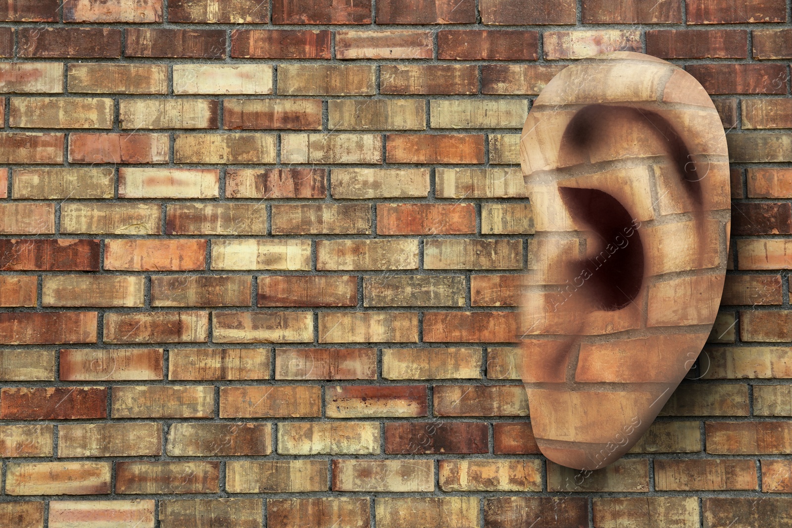 Image of Human ear in brick wall, space for text. Eavesdropping, concept that even walls have ears