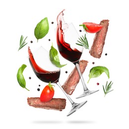 Image of Red wine in glasses, grilled beef meat, tomatoes and spices falling on white background