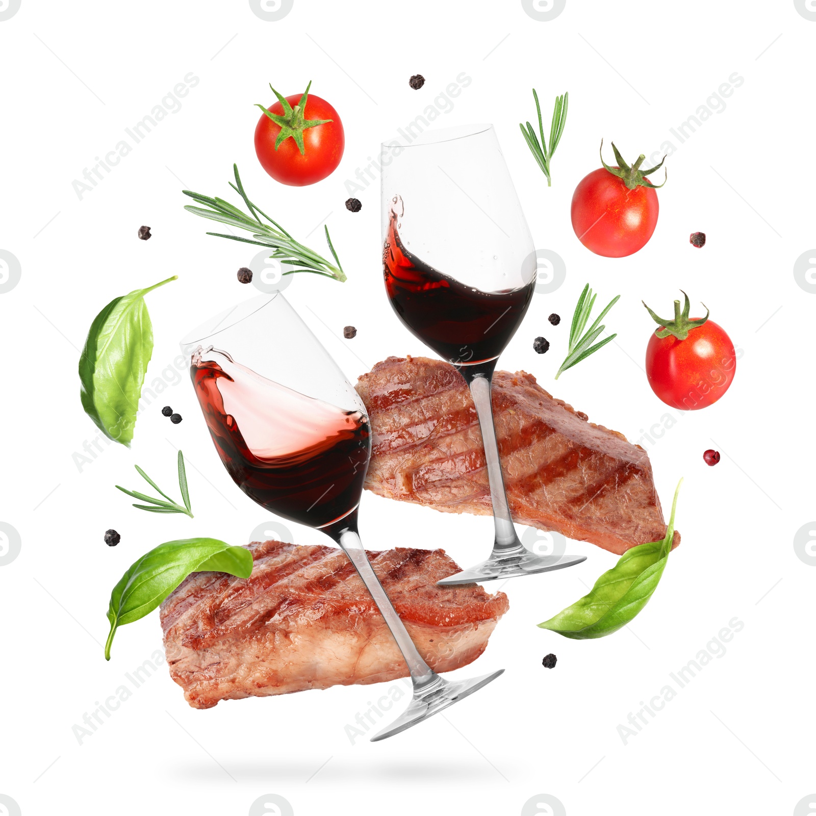 Red wine in glasses, grilled beef steaks, tomatoes and spices falling on white background Image of Red wine in glasses, grilled beef steaks, tomatoes and spices falling on white background