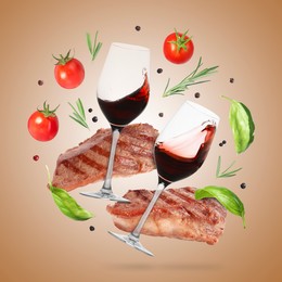 Image of Red wine in glasses, grilled beef steaks, tomatoes and spices falling on pale brown gradient background