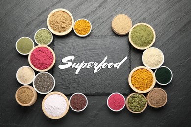 Image of Superfood. Different powders and products in bowls on black table, flat lay