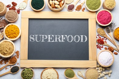 Image of Superfood. Different powders, food products and board on light table, flat lay
