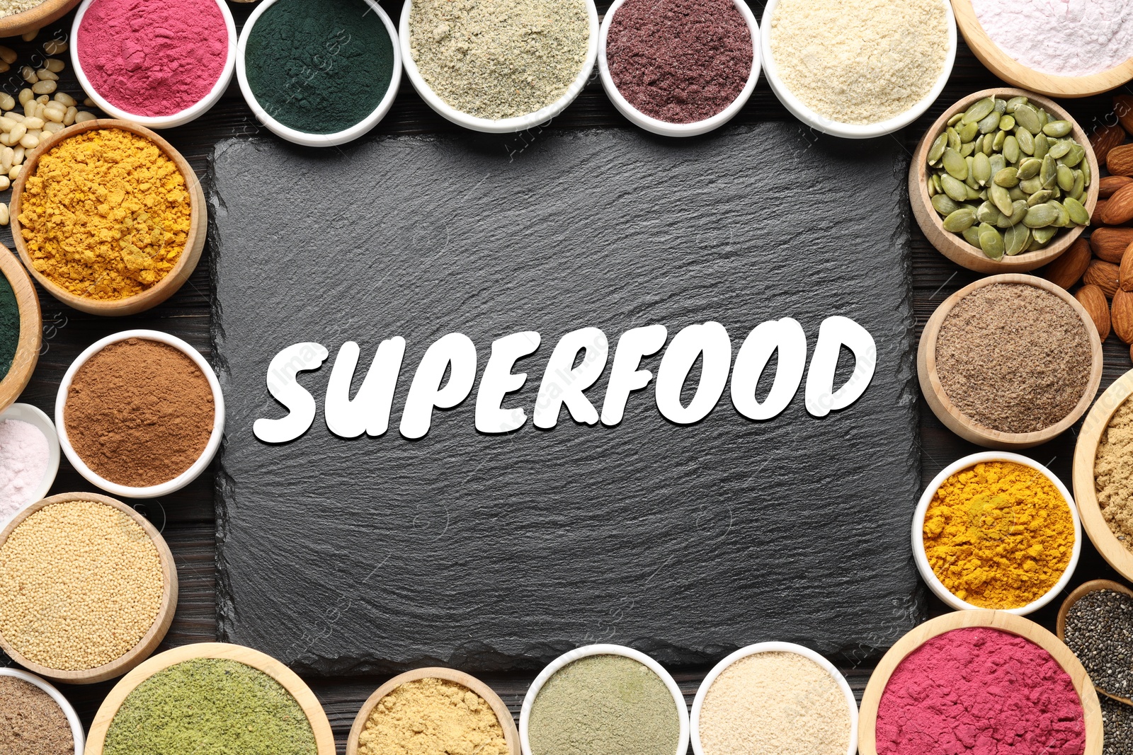 Image of Superfood. Different powders, food products and slate board on wooden table, flat lay