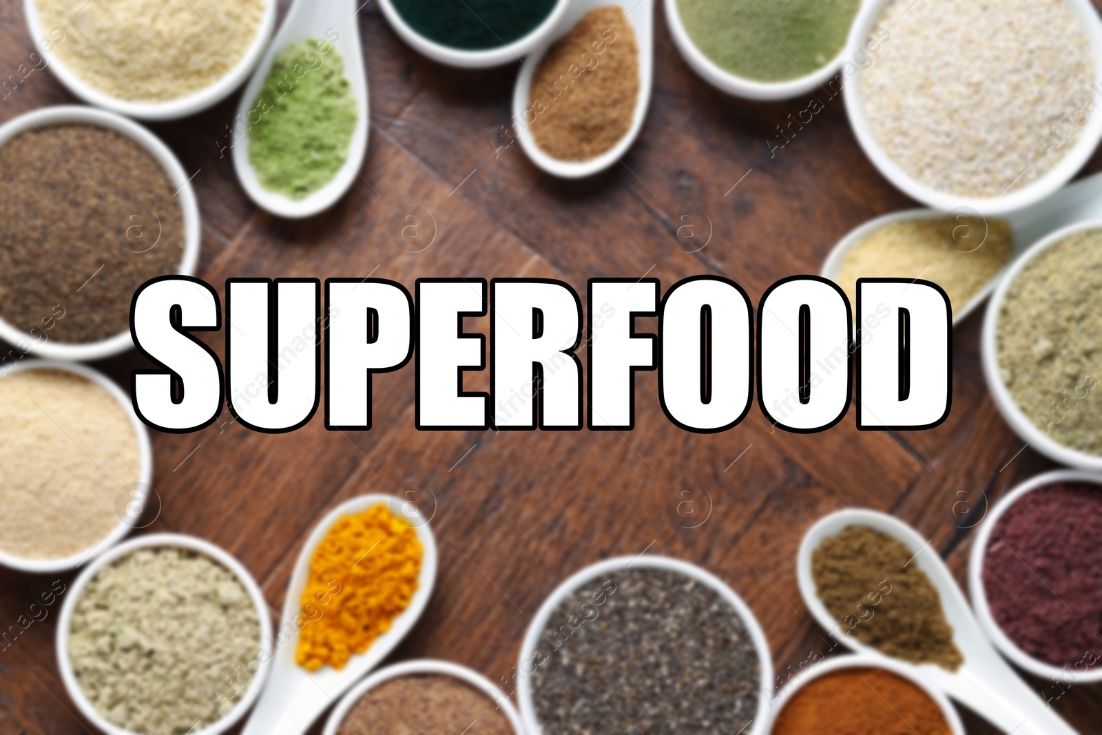 Superfood. Different powders in bowls and spoons on wooden table, flat lay Image of Superfood. Different powders in bowls and spoons on wooden table, flat lay