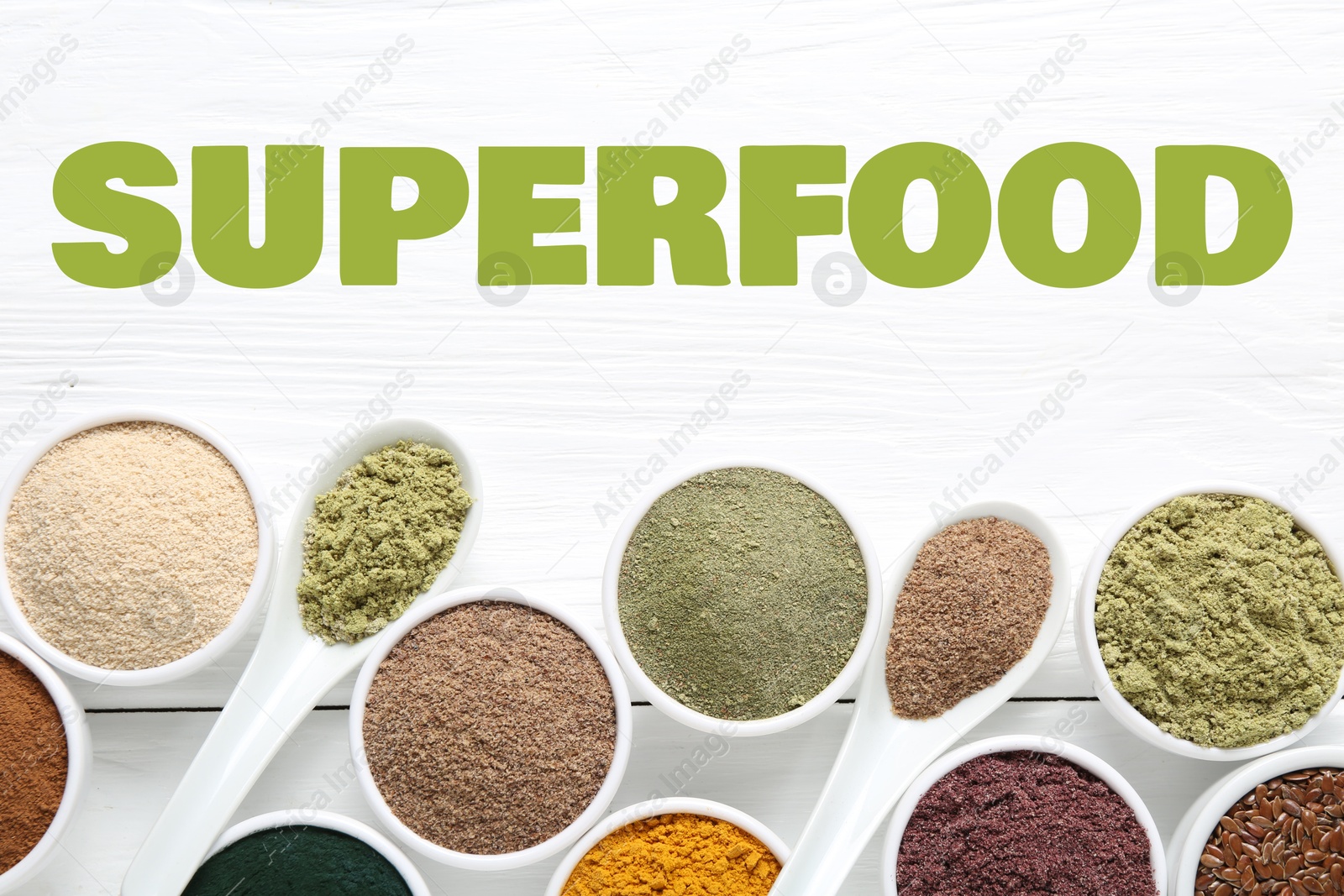 Superfood. Different powders and flaxseeds on white wooden table, flat lay Image of Superfood. Different powders and flaxseeds on white wooden table, flat lay