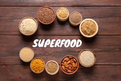 Image of Different superfoods in bowls on wooden table, flat lay
