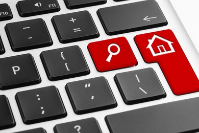 Image of Online accommodation search. Buttons with house and magnifying glass icons on computer keyboard, closeup