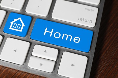 Image of Online accommodation search. Buttons with house icon and word House on computer keyboard, closeup