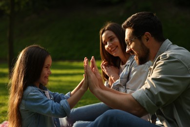 Photo of Happy family spending time together in park