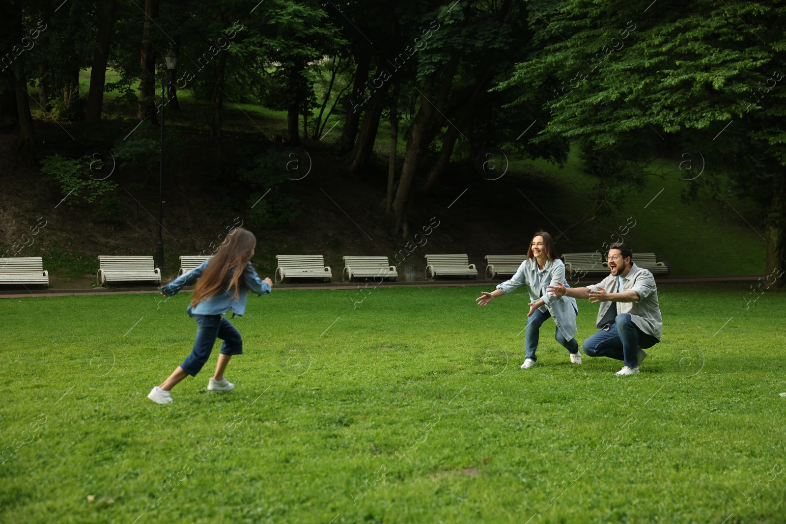 Happy family spending time together in park Photo of Happy family spending time together in park