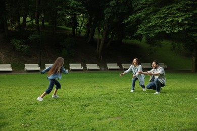 Photo of Happy family spending time together in park