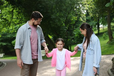 Photo of Happy family spending time together in park