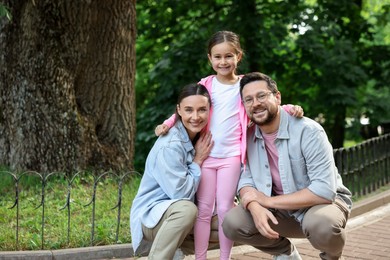 Photo of Happy family spending time together in park