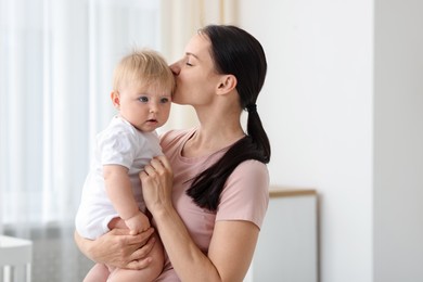 Photo of Mother with her little baby at home, space for text