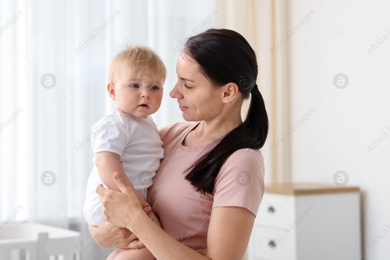 Mother with her little baby at home Photo of Mother with her little baby at home