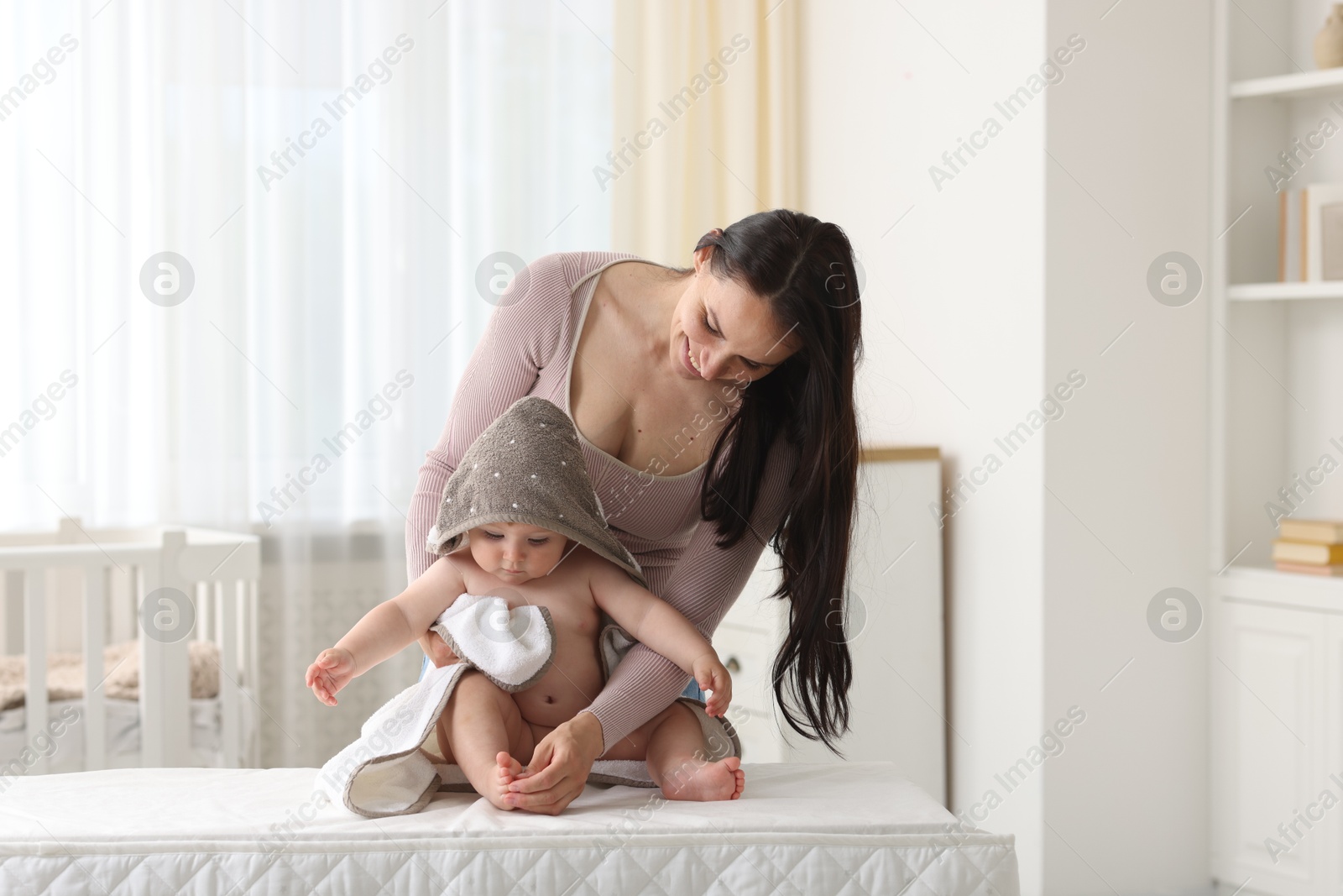 Photo of Mother with her cute baby at home