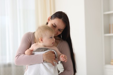 Photo of Mother with her cute baby at home, space for text