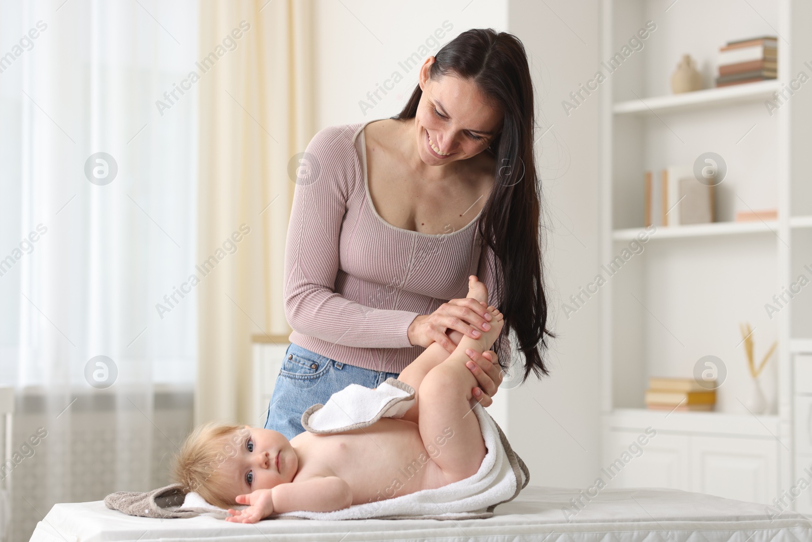 Photo of Mother with her cute baby at home