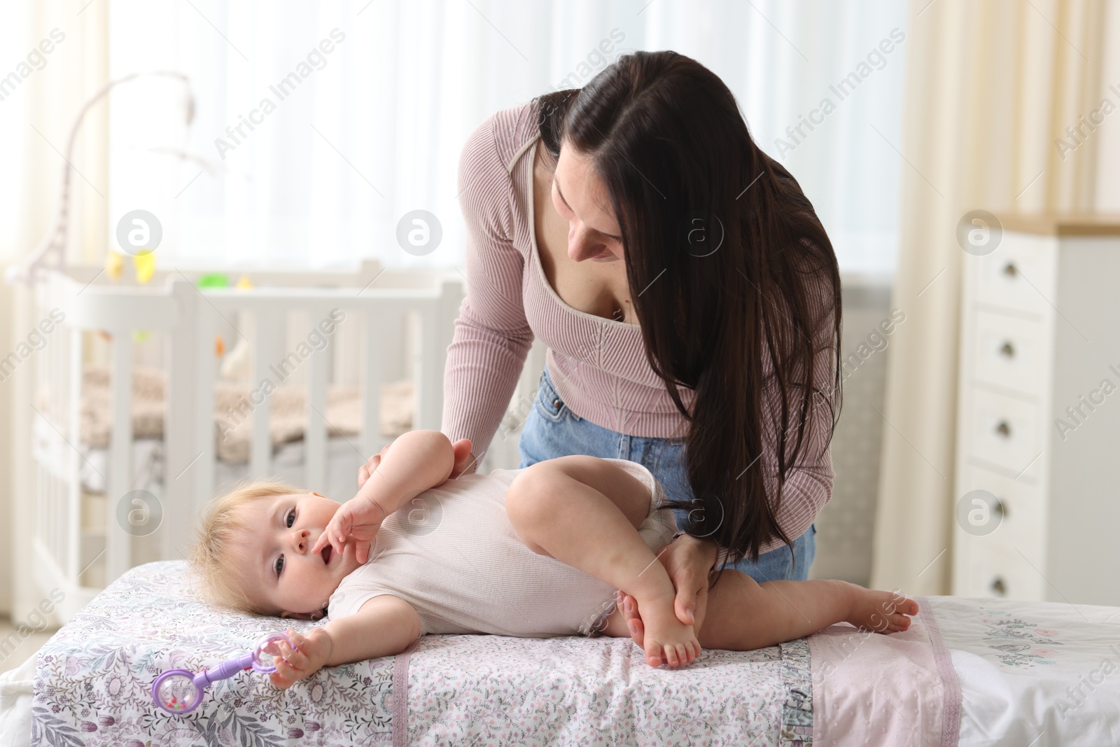 Photo of Mother with her cute baby at home