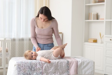 Photo of Mother with her cute baby at home, space for text