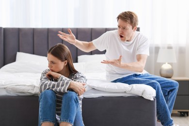 Photo of Woman and man having quarrel at home