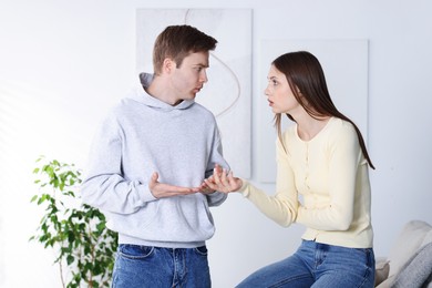 Photo of Woman and man having fight at home