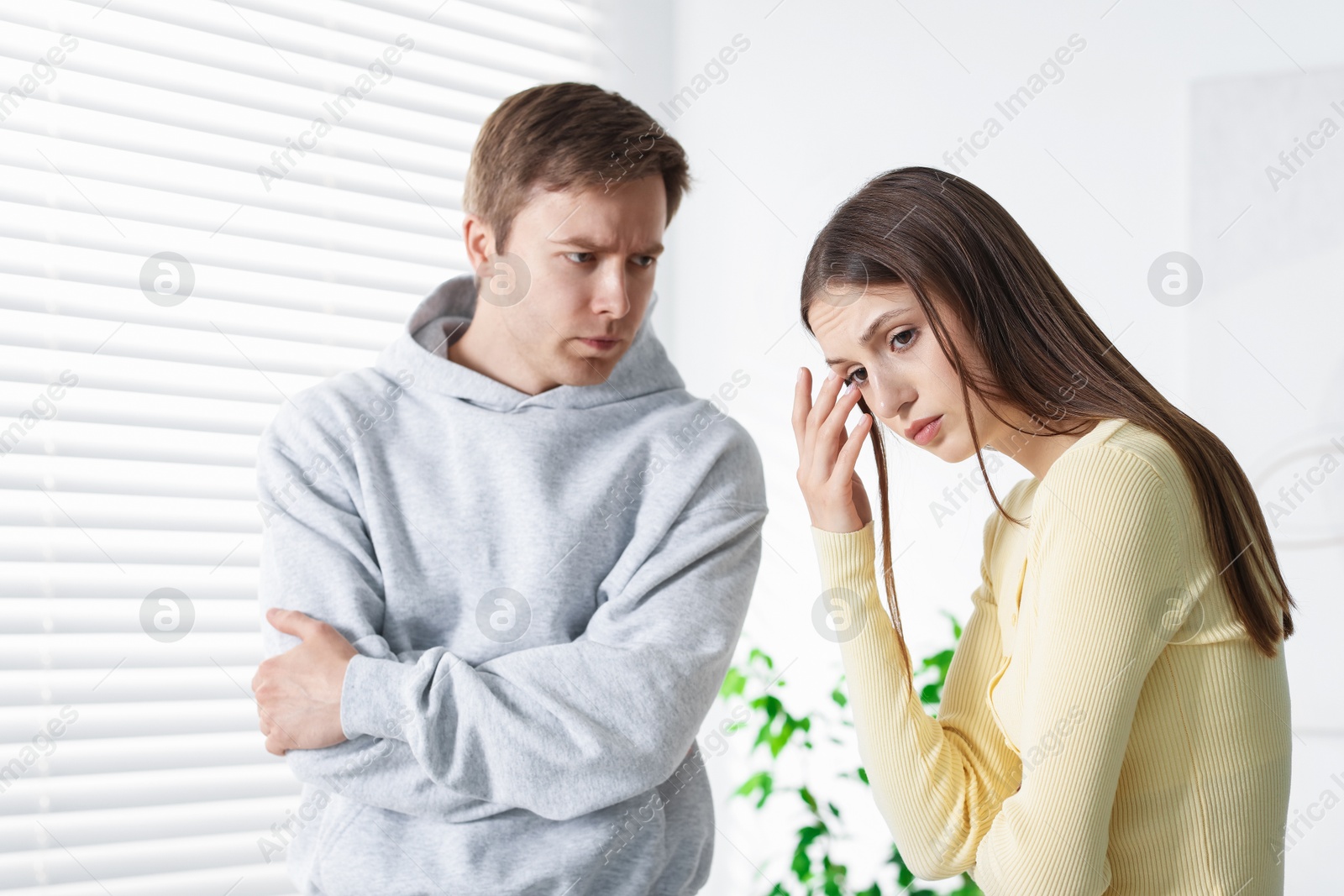 Photo of Woman and man having quarrel at home