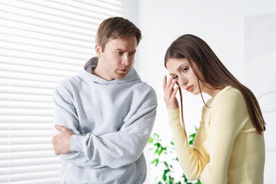 Photo of Woman and man having quarrel at home