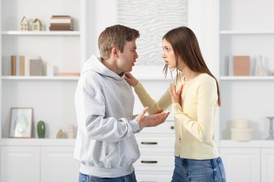 Photo of Woman and man having fight at home